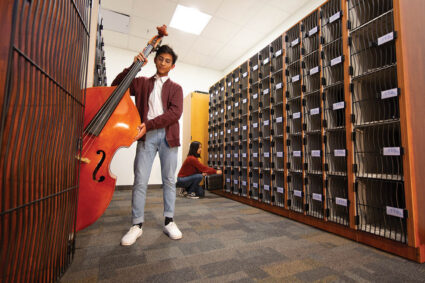 AcoustiCabinets® line the walls for efficient instrument storage.